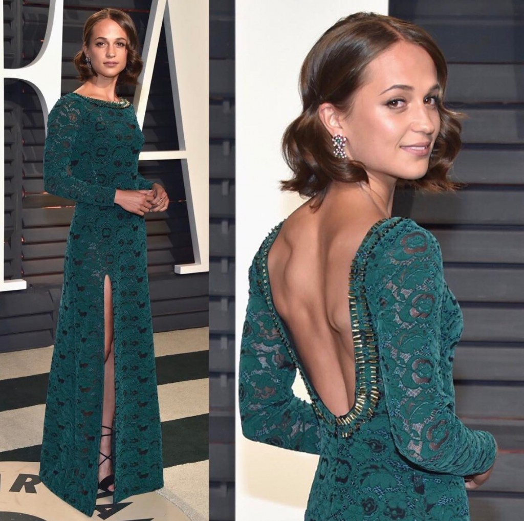 BEVERLY HILLS, LOS ANGELES, CA, USA - FEBRUARY 26: Actress Alicia Vikander  wearing a Louis Vuitton dress and Bulgari jewelry arrives at the 2017  Vanity Fair Oscar Party held at the Wallis